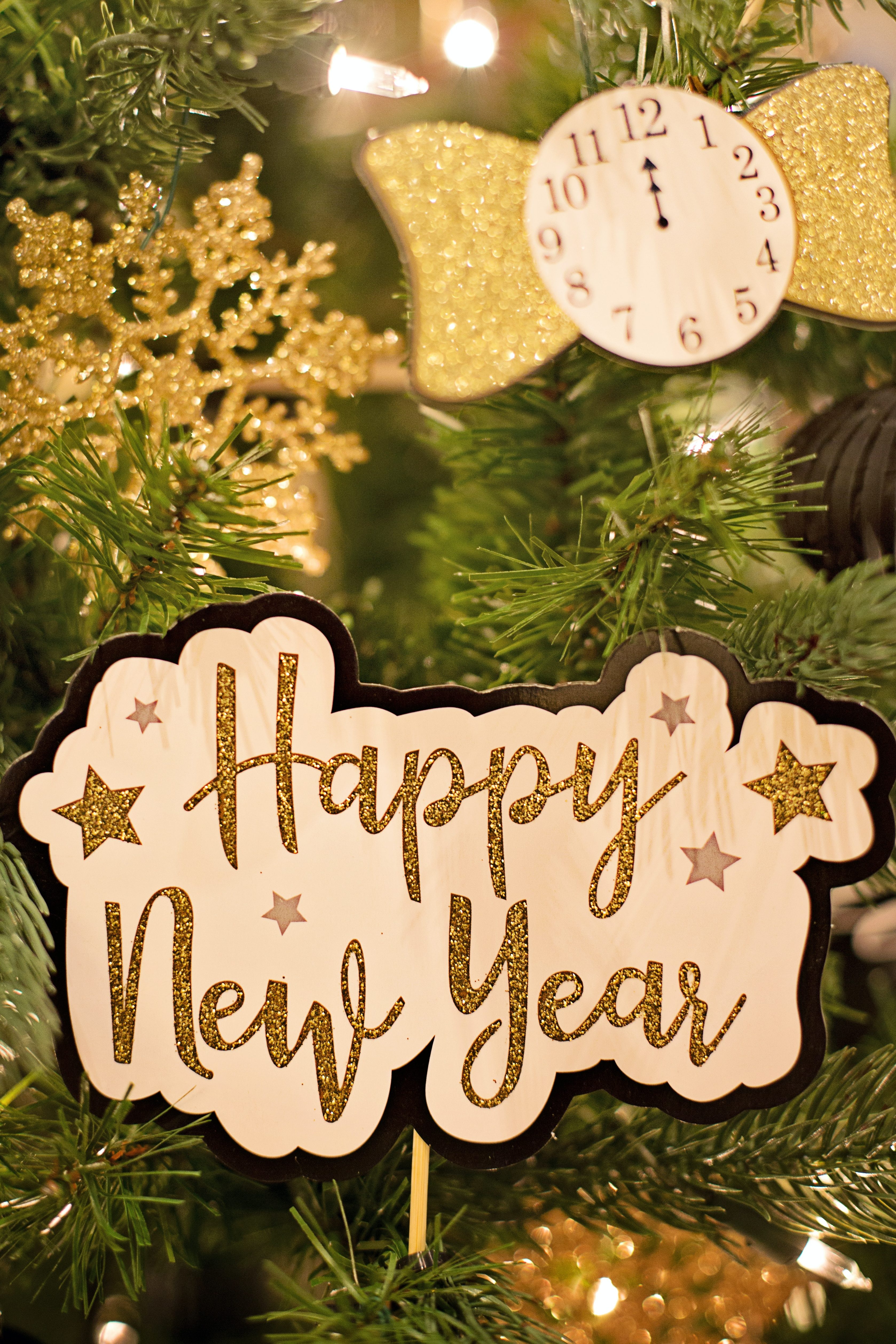 happy near year sign on a festive tree