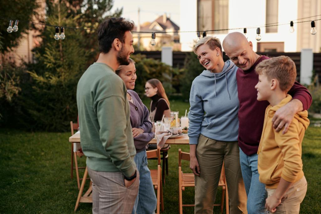 a family enjoying a picnic in the backyard