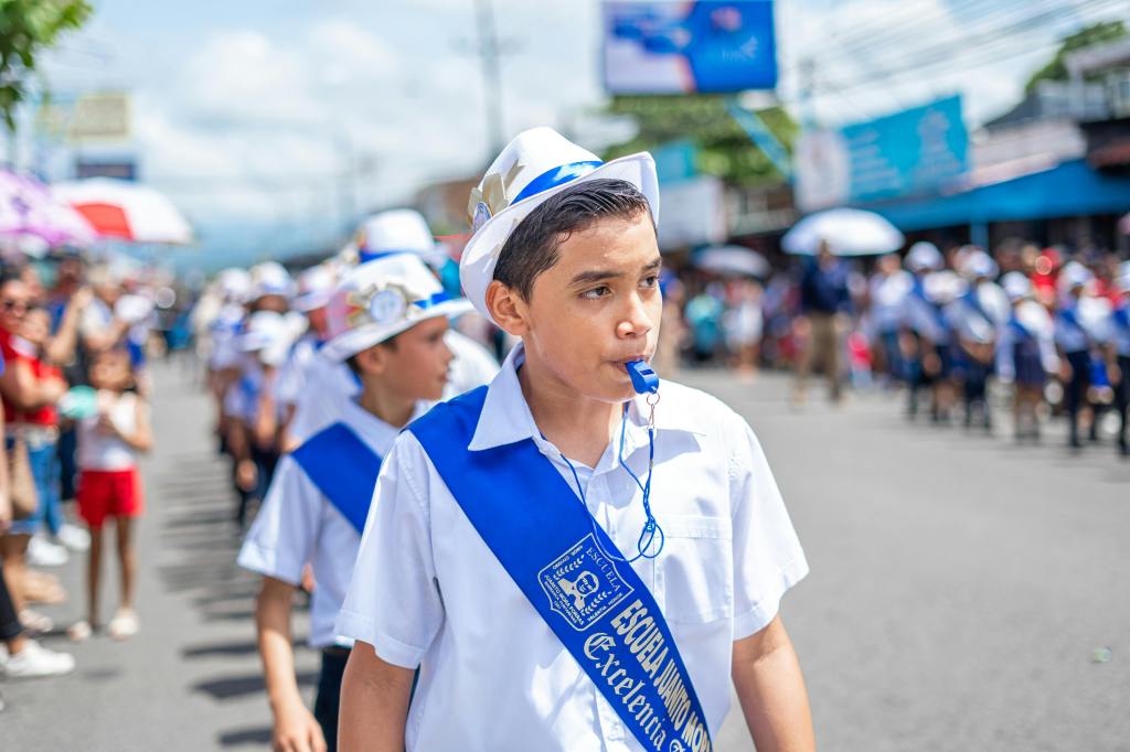 boy whistling in a parade
