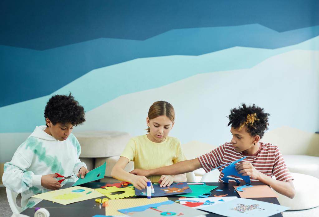kids using their imaginations to create paper crafts