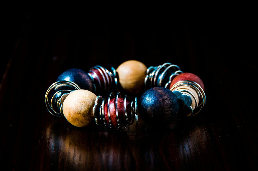 a bracelet made from wood and wire
