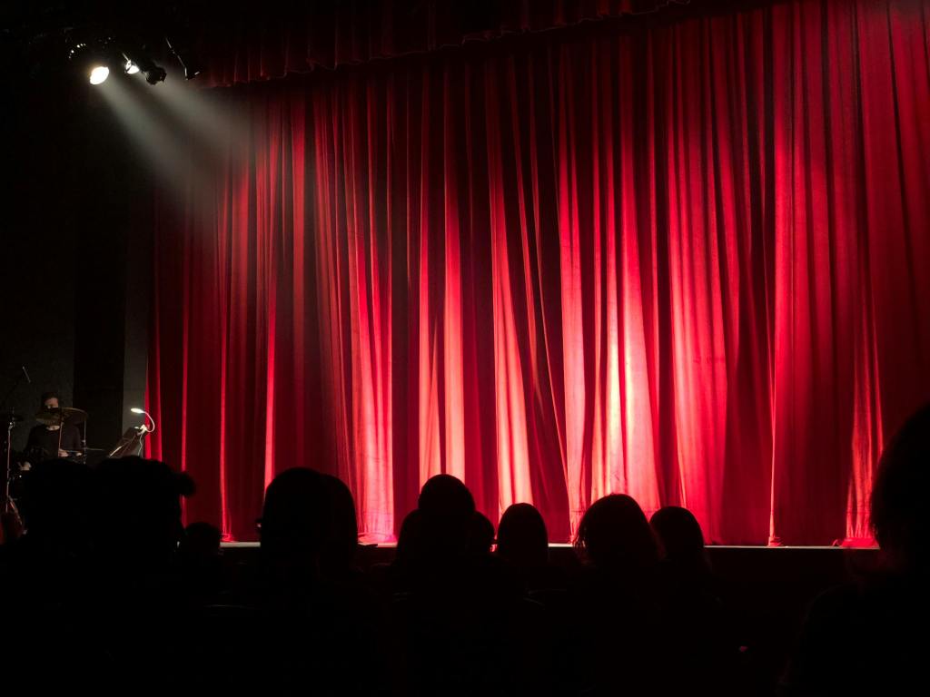 stage with red curtains and spotlights